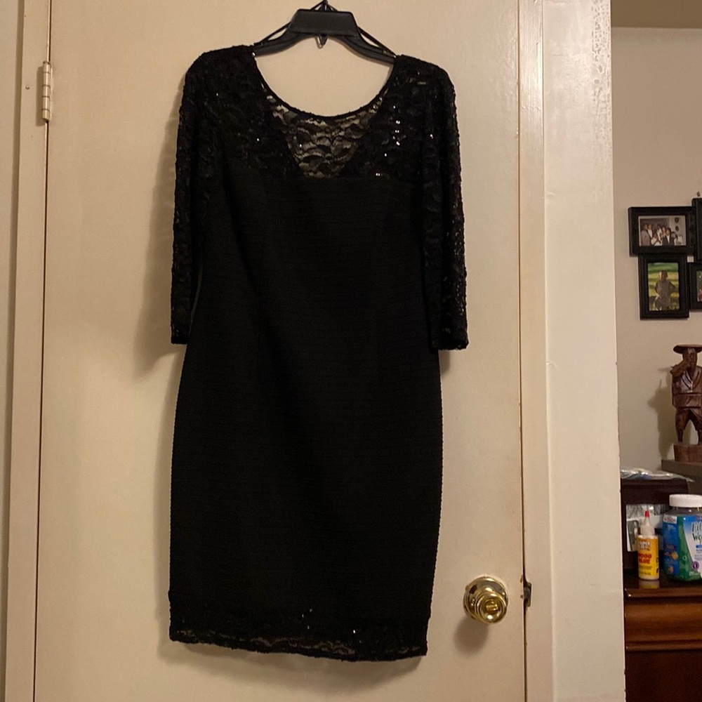 This dress worn twice for two black and white wedding.